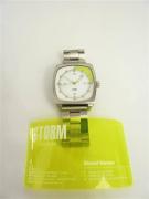 Lote 575 - Relógio de senhora marca Storm, com caixa e bracelete de metal, mostrador branco e verde com calendário, com estojo de origem