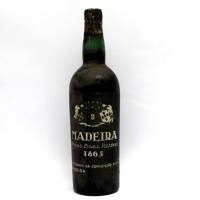 Lote 60 - Garrafa de Vinho da Madeira Royal Boal Reserve de 1865, Luiz Gomes da Conceiçao e Filhos. Idêntica à venda por € 395 em http://www.garrafeiranacional.com/1865-madeira-boal-reserve-luis-gomes-conceicao.html . Nota: rótulo ligeiramente danificado.