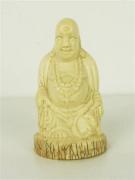 Lote 1056 - Escultura em marfim, China sec XX, motivo "Buda da abundância", com 9cm de altura.