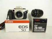 Lote 1460006 - Lote composto por máquina fotográfica usada Canon EOS 50, lente Canon Ultrasonic EF 28-105 mm em embalagens de origem