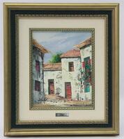 Lote 95 - Original - Pintura a óleo sobre tela com motivo de casas, assinada pela pintora A. Mena, com moldura em madeira dourada e branca. Dimensão: mancha pictórica 24x19 cm, moldura 40x35 cm. Bom estado geral, moldura com pequenas marcas pontuais.