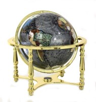 Lote 4021 - Globo terrestre revestido a pedras semipreciosas, madrepérola e esmaltes, com suporte de metal dourado, articulado em esfera armilar e base com bússola, com cerca de 45 cm de altura e 45 cm de diâmetro, pequenos sinais de uso