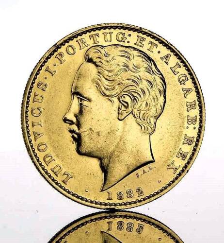 Lote 94 - Moeda de ouro - 10.000 Reis de D. Luís I de 1882. Peso: 17.74 g. Notas: moeda idêntica foi vendida por € 750 numa leiloeira de Lisboa