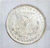 Lote 3007 - Moeda de One Dollar, dos Estados Unidos da América, George Washington, em Prata de 900, de 1884. Peso: 26,7 g. Nota: moeda similar à venda por € 336 em http://www.ebay.com/itm/1884-CC-MORGAN-DOLLAR-PCGS-MS-65-RARE-/322022231314 - 2