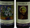 Lote 1788 - CONJUNTO DE VINHOS - 2 Garrafas de Vinho Tinto, Comemorativas 450 Anos S. Francisco Xavier, Adega Coop. Torres Vedras, Reserva 1989 (750ml - 11,5%vol), Ondarre 1995 (750ml-12,8%vol). Nota: em caixa de madeira - 3