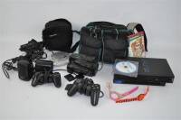 Lote 14 - Lote composto por consola PLAYSTATION 2, com comandos, cartão de memória de 8 MB , adaptador para 4 cartões de memória, 2 mini colunas de som SONY Stereo Speaker System , carregador de pilhas SONY, camera de filmar Sony Handycam, leitor de CD po