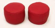 Lote 103 - PUFFS - Par de pequenos puffs em forma circular forrados a napa vermelha. Dim.: 25x33 cm. Sinais de uso
