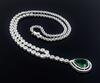 Lote 6055 - GARGANTILHA DE DIAMANTES EM OURO BRANCO 18 KT - Toque 750. Cravejada com cerca de 400 Diamantes de elevada pureza em talhe brilhante redondo e 1 Zircónia de cor verde transparente VVS, com 3.00 ct em talhe brilhante pera. Peso: 23,53 g. Dim: 4 - 6