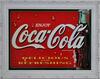 Lote 60 - Placa publicitária em metal da Coca-Cola, antiga, com 42x57 cm. Moldura branca trabalhada com 54x69 cm. Peça de colecção. Muito decorativa