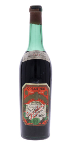 Lote 3012 - COLLARES RESERVA VELHO 1960 - Garrafa de Vinho Tinto, Collares Genuíno, Viúva José Gomes da Silva & Filhos, (700ml aprox.). Nota: garrafa idêntica à venda por € 275 (USD 320). lacre algo danificado e ligeira perda adequada ao período de engarr