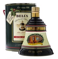 Lote 3039 - WHISKY BELL'S CHRISTMAS 1991 - Garrafa Decanter de Whisky, Old Scotch Whisky, (700ml - 40%vol). Nota: garrafa idêntica à venda por € 96,76 (£ 85). Em caixa/tubo de cartão original. Consultar valor Indicativo em https://www.robbieswhiskymerchan