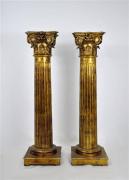 Lote 2047 - Par de colunas jónicas de madeira entalhada e dourada, portuguesas, século XVIII, decoração canelada e capitel com volutas, redouradas, com 146 cm de altura