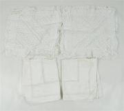 Lote 11 - Lote composto por 2 pares de almofadas brancas com bordado inglês, com 63x76 cm e 55x55 cm