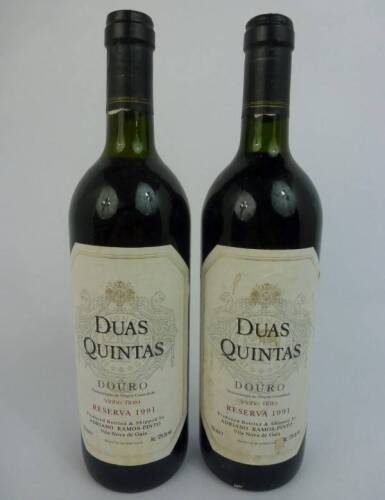 Lote 1073 - Lote de 2 garrafas de Vinho Tinto, DUA QUINTAS Reserva, Ramos Pinto, Douro, colheita de 1991, para coleccionadores. Valor estimado por garrafa 60/70€.