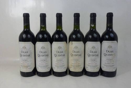 Lote 1188 - Lote de seis garrafas Duas Quintas - Ramos Pinto Reserva de 1991, Douro. Com valor em garrafeira de cerca de 60€ cada garrafa. Para coleccionadores. Nota: pequenas falhas nos rótulos.