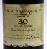 Lote 96 - GRAHAM 30 ANOS - Garrafa antiga de Vinho do Porto. W.&J. Graham & Co. - 30 Years of Age Tawny - Finest Port from tge Cask. Produce of Portugal (70cl,20%vol.). Nota: Encontra-se totalmente fechada, alguns rasgos no rótulo. - 3