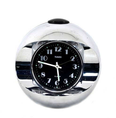 Lote 21 - TIMEX, RELÓGIO DESPERTADOR - West Germany, modelo em acrílico preto e cromado. Movimento de corda manual. Mostrador preto com numeração àrabe e ponteiro de segundos. A funcionar. Dim: 12 cm de diâmetro