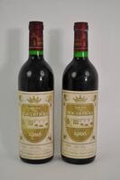 Lote 1744 - Duas garrafas de vinho tinto Quinta da Bacalhoa, colheita de 1986. Com valor de venda cada garrafa na Garrafeira Napoleão de 37,95€, perfazendo um total do lote de 75,9€. Para coleccionadores.