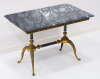 Lote 247 - MESA DE APOIO - mesa de apoio de tampo retangular em mármore com estrutura em latão dourado ornamentado com motivos vegetalistas. Dimensão: 48x69x41 cm. Marcas de uso - 2