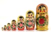 Lote 48 - MATRIOSKA, ARTESANATO DA RÚSSIA - Boneca artesanal em madeira pintada à mão, com 7 unidades, decoração policromada com figura e flores. Dim: 17 cm (maior)