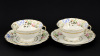 Lote 132 - VISTA ALEGRE, CHÁVENAS DE CHÁ - Conjunto de 3 chávenas com pires em porcelana marcada na base (1924-1947) e (1947-1968), decoração floral policromada com frisos dourados. Dim: 15 cm (pires) - 2