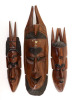 Lote 149 - ARTE AFRICANA, MÁSCARAS - Conjunto de 3 máscaras em madeira exótixa entalhada com decoração relevada e policromia, modelos diferentes. Dim: 39 cm (maior)