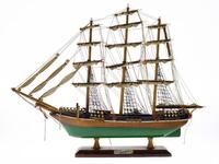 Lote 245 - CUTTY SARK, VELEIRO - Modelo de veleiro em madeira pintada com velame em tecido, com 3 mastros principais. Assente em base de madeira com placa e inscrição "Cutty Sark". Dim: 42x55x8 cm. Nota: pequenos defeitos