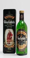 Lote 160 - WHISKY GLENFIDDICH - Garrafa de Whisky, Reserva Especial Antiga, Single Malt, Whisky Escocês Pure Malt, William Grant & Sons, Escócia, (700ml - 40% vol.). Nota: garrafa dos anos 1980s. Garrafa semelhante à venda por € 113,14. Em caixa de metal 