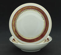 Lote 159 - SCHMIDT PORCELANA - Conjunto de 2 taças em porcelana Schmidt Brasil com faixa bordeaux e dourada com motivos vegetalistas. Dim: 14 cm (diâmetro)