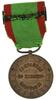 Lote 184 - MEDALHA MILITAR DA REPÚBLICA PORTUGUESA - Medalha em bronze das Campanhas do Exército Português com a respectiva fita e travessa com a Inscrição "No Mar" e as datas 1916, 1917 e 1918. Dim: 7,5cm (fita incluída) - 2