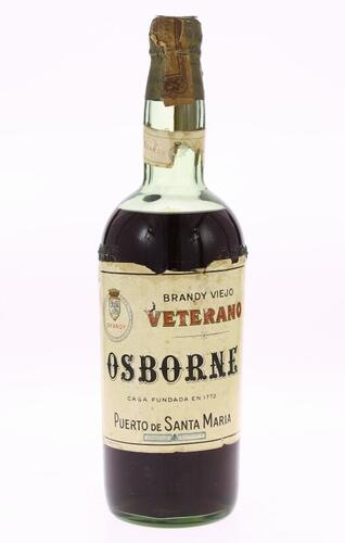 Lote 122 - BRANDY VETERANO OSBORNE - Garrafa de Brandy Viejo, Veterano, Osborne, Puerto de Santa Maria, Espanha, (750ml aprox.). Nota: garrafa antiga