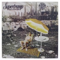 Lote 159 - SUPERTRAMP - "CRISIS? WHAT CRISIS?" - Disco de vinil, LP de 33 rpm, de 1975. Capa em bom estado e disco sem sinais de uso