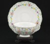 Lote 6 - FUNDAÇÃO AMÁLIA RODRIGUES, SERVIÇO DE CHÁ - Em porcelana executado por NG Porcelanas. Composto de bule, açucareiro e 6 chávenas de chá com 6 pires. Decoração floral policromada e dourada. Dim: 18 cm (bule). Nota: marcados na bases - 3