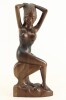 Lote 107 - ESCULTURA EM MADEIRA - Representando figura feminina desnuda com feições orientais. Dim: 36 cm. Nota: apresenta colagem de um braço