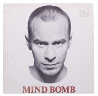 Lote 202 - THE THE - "MIND BOMB " - Disco de vinil, LP´de 33 rpm, de 1989, editora CBS, capa em bom estado com alguns sinais de armazenamento e disco sem sinais de uso. Inclui encarte original e editado na Holanda