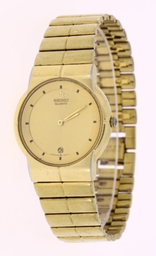 Lote 58 - SEIKO, RELÓGIO DE PULSO - Caixa em aço dourado com 34 mm e bracelete em aço dourado. Movimento de quartzo. Mostrador com marcadores e data às 6 horas. Nota: sinais de uso, a funcionar