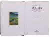 Lote 383 - "O GUIA DO WHISKY DE MALTE - GUIA DO CONHECEDOR", LIVRO, - por Helen Arthur, de 1998, edição Livros e Livros, capa dura, ilustrado Nota: com sinais de armazenameno - 2