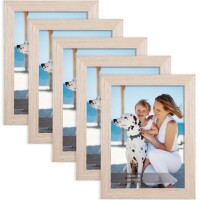 Lote 73 - Conjunto de molduras fotográficas Joyshare de 5 peças, 13x18 cm, acabamento em madeira de carvalho. Perfeito para expor fotos em vários espaços. Elegante e durável. O artigo provém de uma encomenda não entregue ao cliente, está em estado novo, n