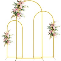 Lote 383 - Wokceer wedding arch backdrop stand set, includes 3 gold metal stands. Perfect for birthdays, weddings, baby showers, and garden balloon decorations. O artigo provém de uma encomenda não entregue ao cliente, está em estado novo, nunca usado, se