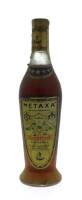 Lote 3250 - Garrafa de Brandy Grego, Metaxa, Gold Label Export, Grécia, Distribuidor Caves Dom Teodósio, (700ml-40%vol). Nota: À venda no Ebay €78,00 (Para Colecionadores).